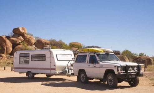 Toyota LandCruiser towing a caravan in the outback with Pedal Torq throttle controller settings for heavy load driving