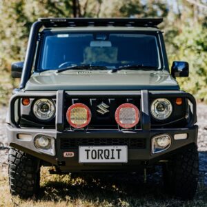 Suzuki Jimny front view with Torqit stainless snorkel and spotlights fitted.