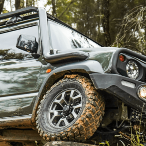 Suzuki Jimny driving off-road with Torqit stainless snorkel fitted.