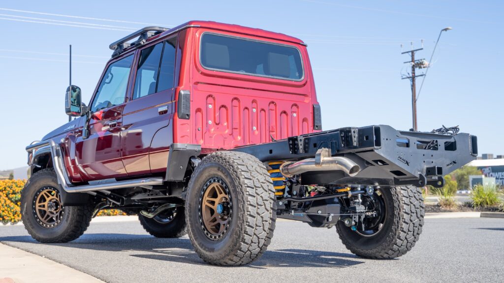 Red Toyota LandCruiser 79 Series build by Jacksons 4x4, featuring Torqit 79 Series Performance Exhaust.