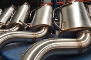 Stainless steel Y62 Patrol Performance Exhaust systems stacked on rack