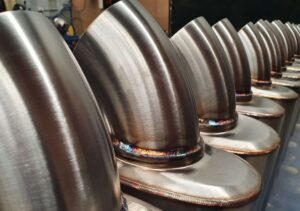 Close-up of stainless steel exhaust bends and welds for Y62 Patrol