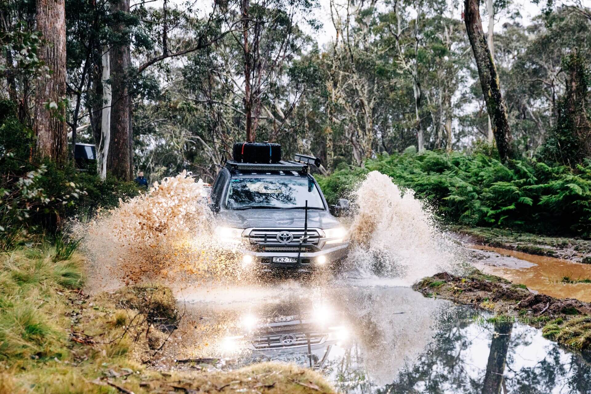 Toyota LandCruiser 200 Series driving through water with Torqit Performance Exhaust upgrade
