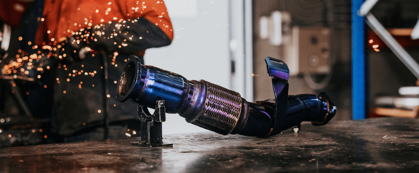 Titanium-coated Torqit dump pipe for heat reduction and high exhaust performance