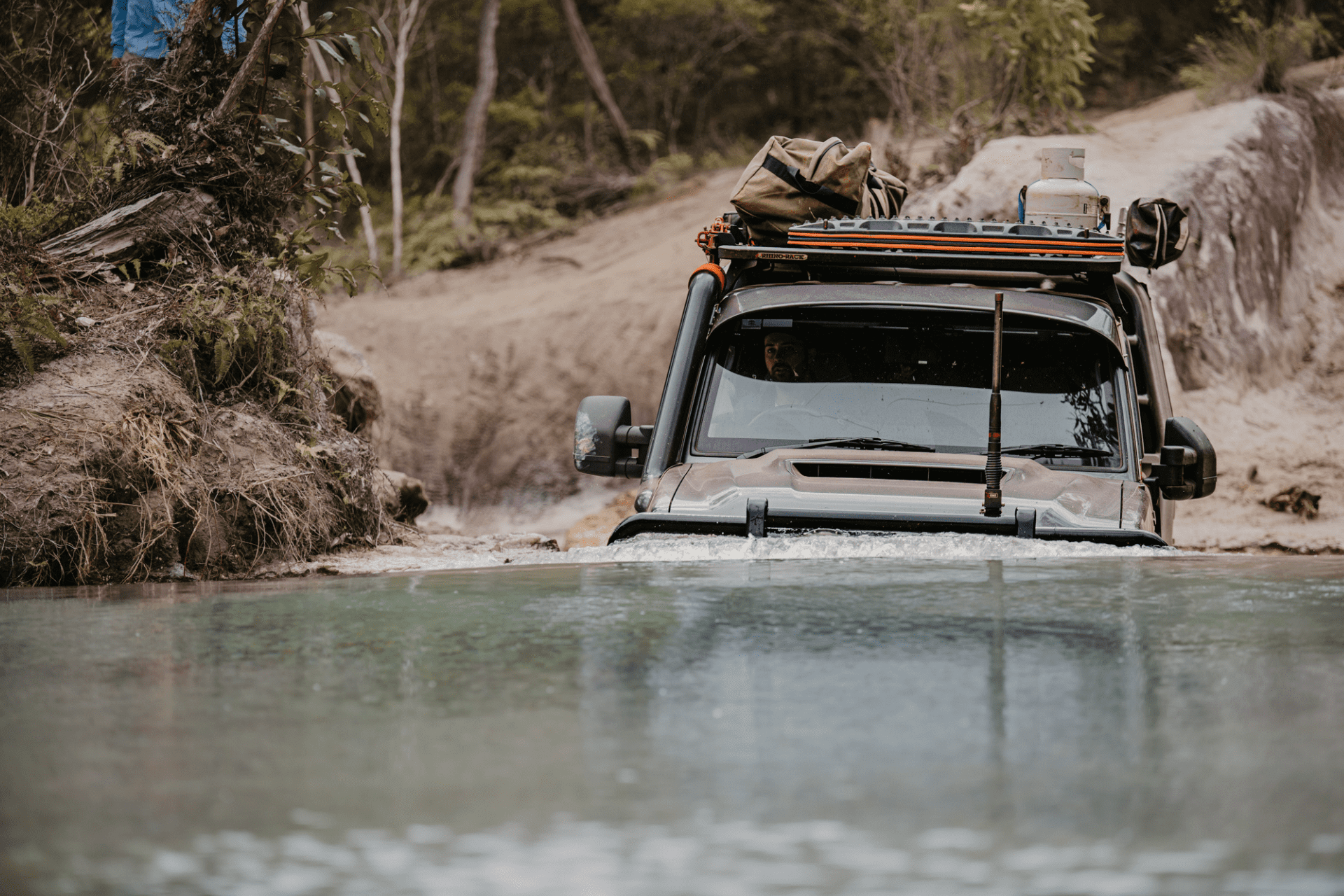 Toyota LandCruiser 79 Series fitted with Torqit stainless snorkel driving through deep water crossing