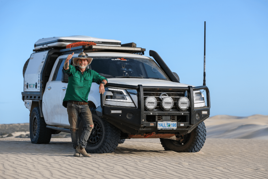 Graham Cahill standing next to a 4WD vehicle at a remote off-road location north of Perth