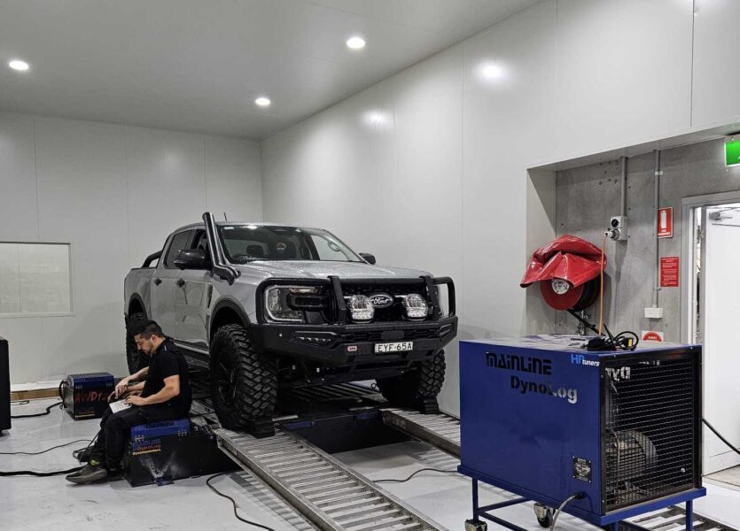 4WD vehicle undergoing dyno tuning test inside Torqit’s performance workshop
