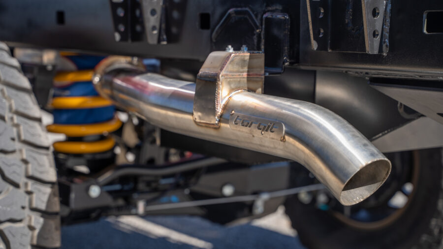 Close-up of Torqit stainless steel exhaust installed on a 4WD